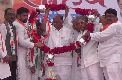 VIDEO: कार्यकर्त्याची हारात घुसखोरी, शरद पवारांचा कोपरानं सर्जिकल स्ट्राईक