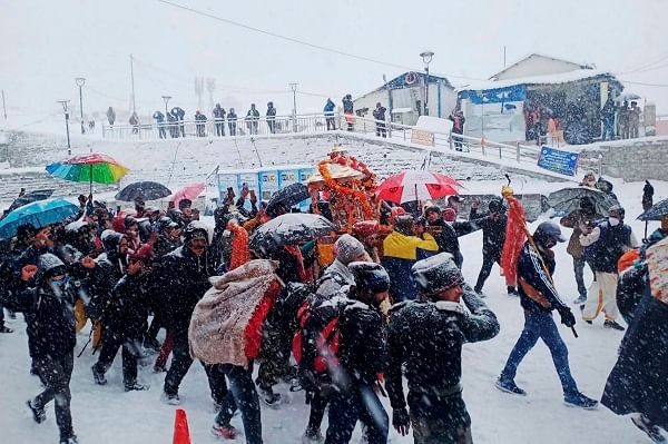 Kedarnath Devotees take part in Panchmukhi Doli festival during snowfall at Kedarnath Dham in Uttarakhand