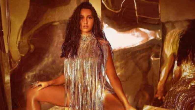 बॉलिवूड अभिनेत्री नोरा फतेही (Nora Fatehi) तिच्या फॅशन सेन्समुळे नेहमीच चर्चेत राहिली आहे. अभिनेत्रीने अलीकडेच आपले ग्लॅमरस आणि बोल्ड फोटो सोशल मीडियावर शेअर केले आहेत. या फोटोंमध्ये नोरा अतिशय सुंदर दिसत आहे.