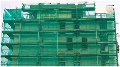 गगनचुंबी इमारतींच्या बांधकामादरम्यान हिरवा कपडा का वापरतात? जाणून घ्या कारण