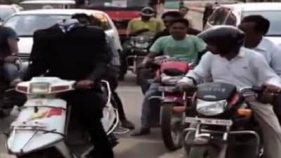 Video | डोळे, डोके नसलेला माणूस, रहदारीत चालवतोय दुचाकी, व्हिडीओ व्हायरल