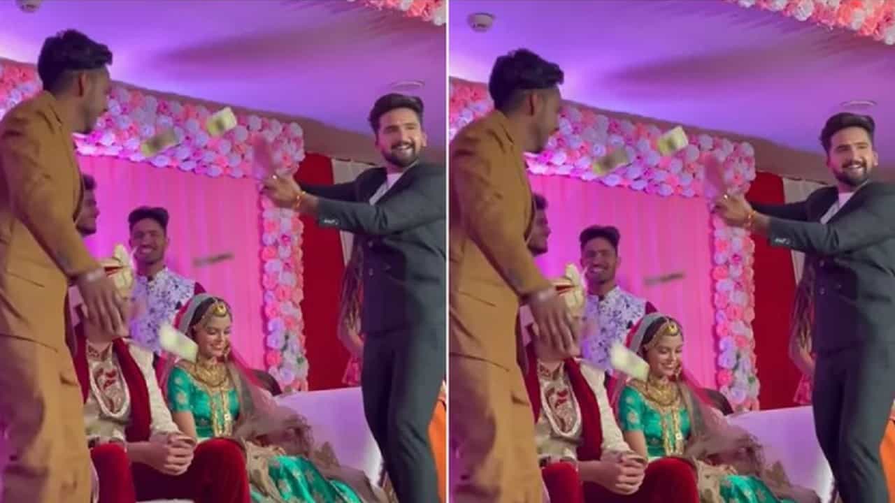 VIDEO : स्टेजवर पैसे उडवतानाचा उत्साह नडला आणि भाऊ थेट नवरदेवाच्या मांडीवर पडला, पाहा लग्नातील खतरनाक व्हिडीओ!