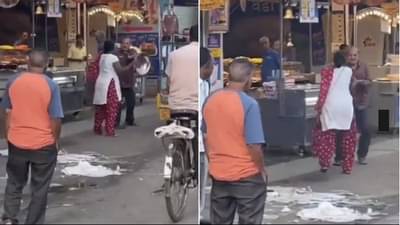 VIDEO | रस्त्याच्या मधोमध पती-पत्नीमध्ये भांडण, पत्नीने नवऱ्याच्या डोक्यावर भांडं मारलं, मग काय झालं पाहा व्हिडीओत