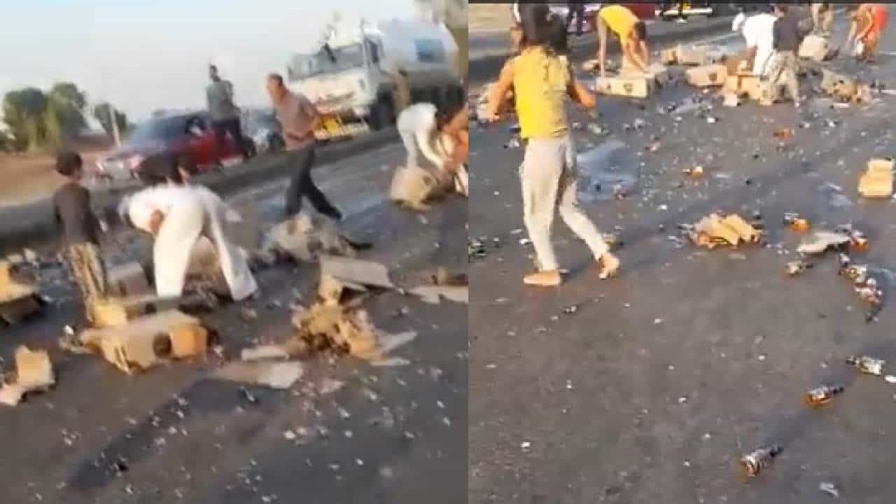 गाडीतून रस्त्यावर पडले दारूचे बॉक्स, तळीरामांची बॉटल्स गोळा करण्यासाठी धावपळ