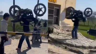video viral : रेल्वे फाटक बंद होते म्हणून पट्ट्याने बाईक खांद्यावर घेतली अन् ...युजर म्हणाले हा तर बाहुबली