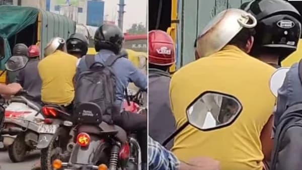 पोलिसांच्या दंडापासून वाचण्यासाठी शक्कल, दुचाकीस्वाराने डोकेच कढईने झाकले, Video पाहून फुटेल हसु